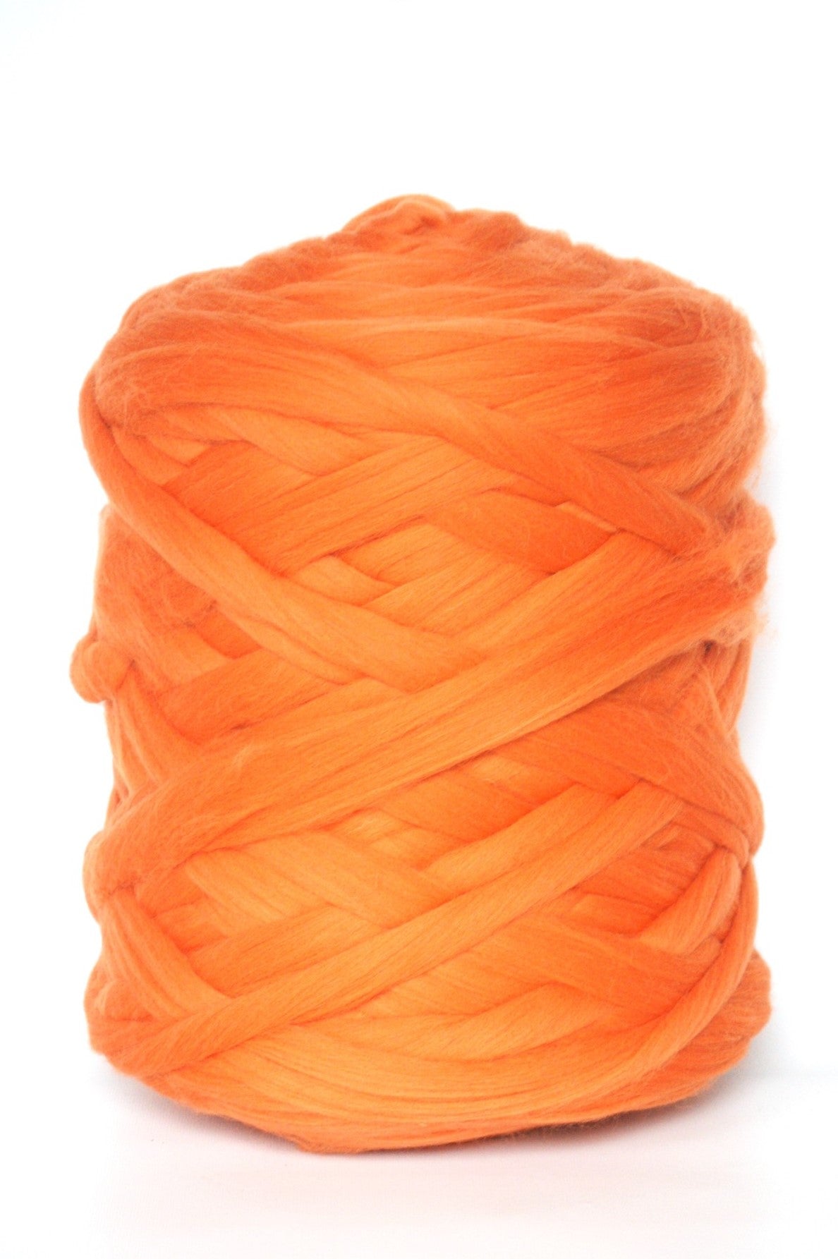Orange chunky wool yarn ball on a white background