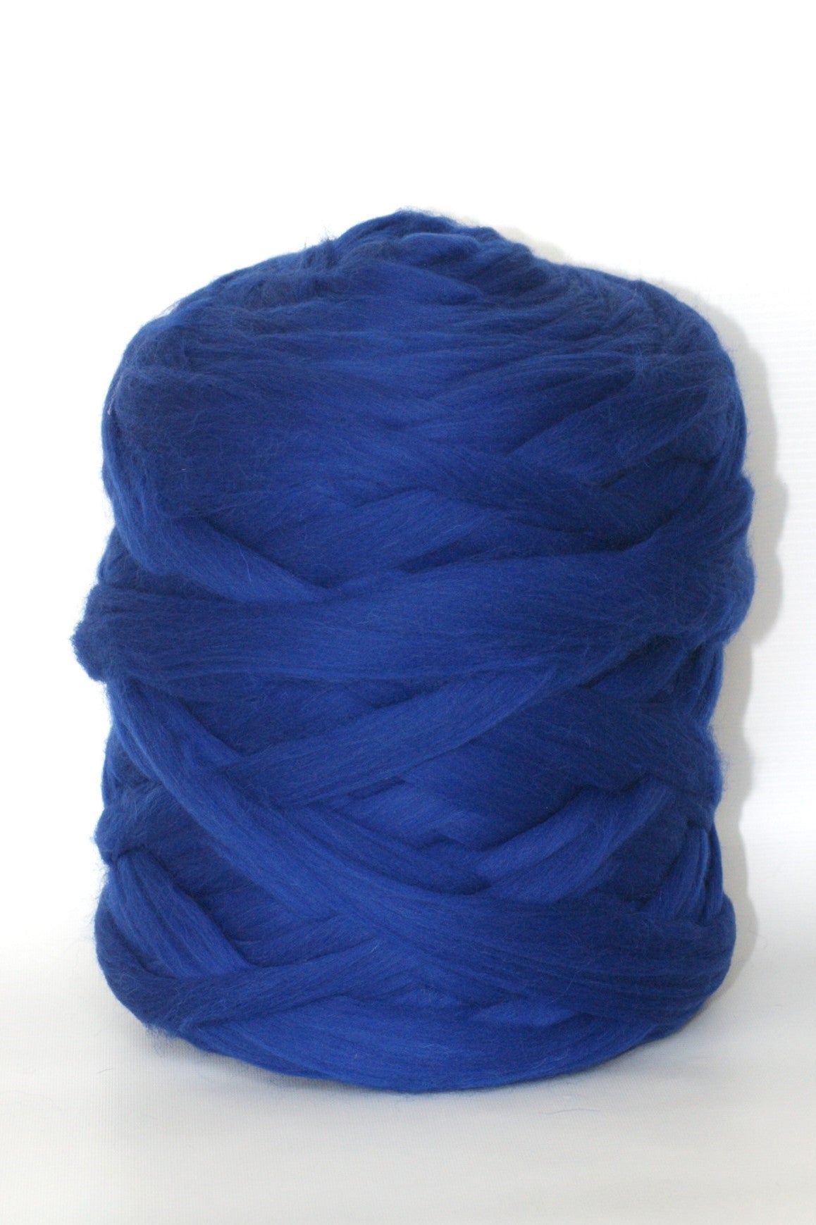 royal blue chunky wool yarn in a white background