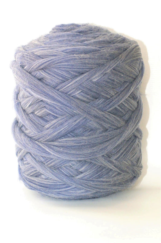 Denim skein of  chunky wool yarn on a white background