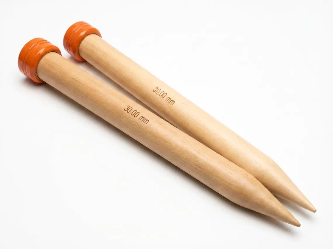Two light natural wood knitpro knitting needles with orange end caps, marked with '30.00 mm' text, on a white background.