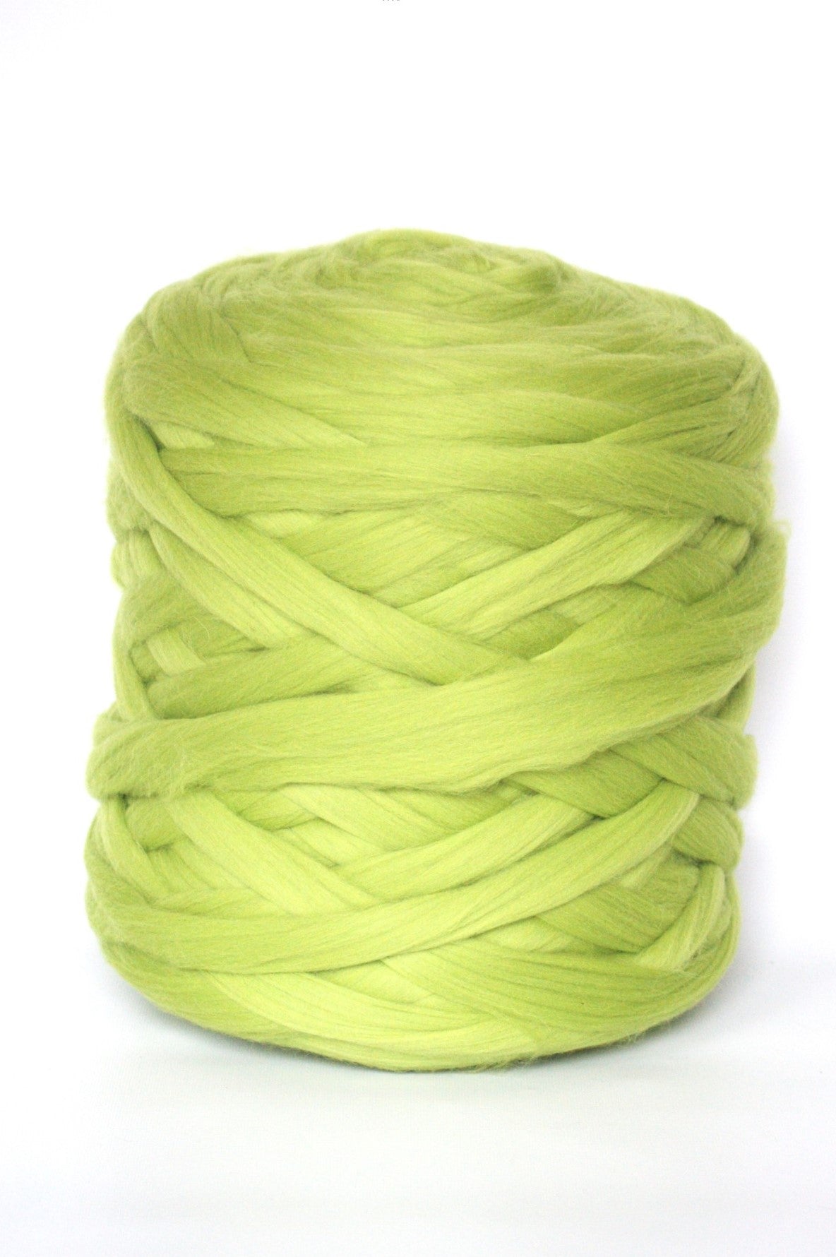 Apple green skein of chunky wool yarn on a white background