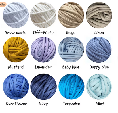 A color chart showing 12 balls of thick plush cord yarn in different colors, labeled with names like Snow white, Off-White, Beige, Linen, Mustard, Lavender, Baby blue, Dusty blue, Cornflower, Navy, Turquoise, and Mint on a white background.