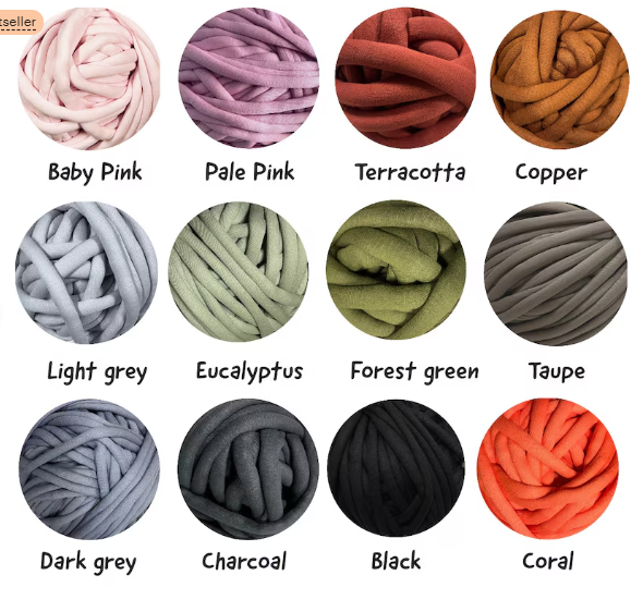A color chart showing 12 thick plush yarn balls arranged in a 3x4 grid on a white background, each labeled with its color name: Baby Pink, Pale Pink, Terracotta, Copper, Light grey, Eucalyptus, Forest green, Taupe, Dark grey, Charcoal, Black, and Coral.