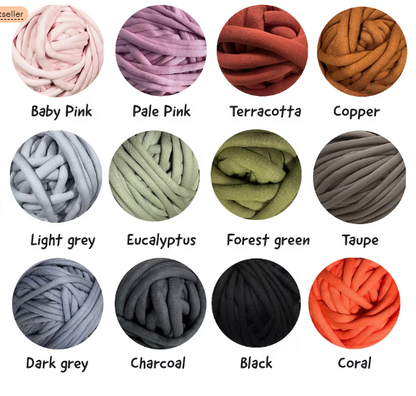 A color chart showing 12 thick plush yarn balls arranged in a 3x4 grid on a white background, each labeled with its color name: Baby Pink, Pale Pink, Terracotta, Copper, Light grey, Eucalyptus, Forest green, Taupe, Dark grey, Charcoal, Black, and Coral.
