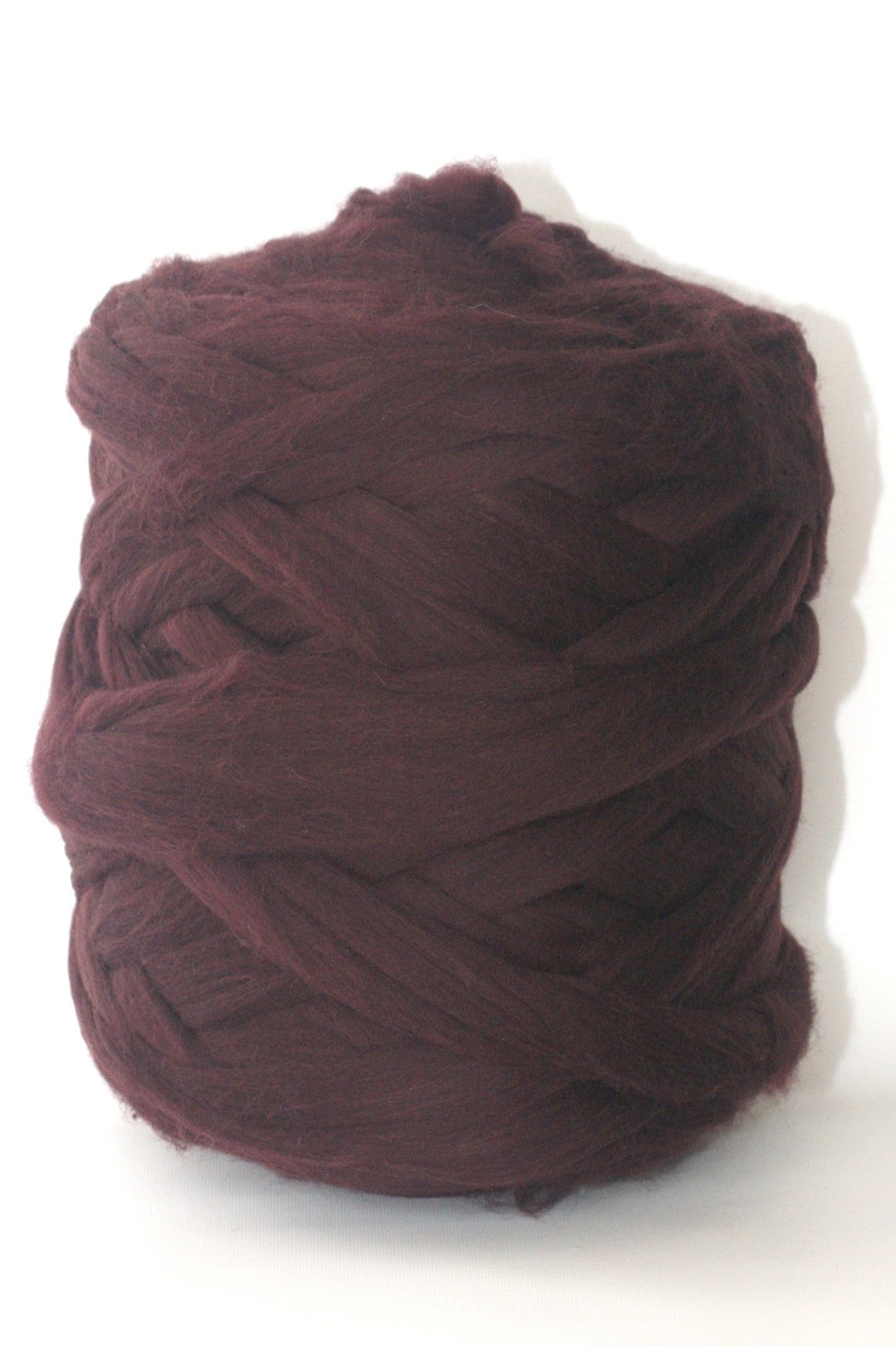 Ball of Eggplant chunky wool  yarn on a white background