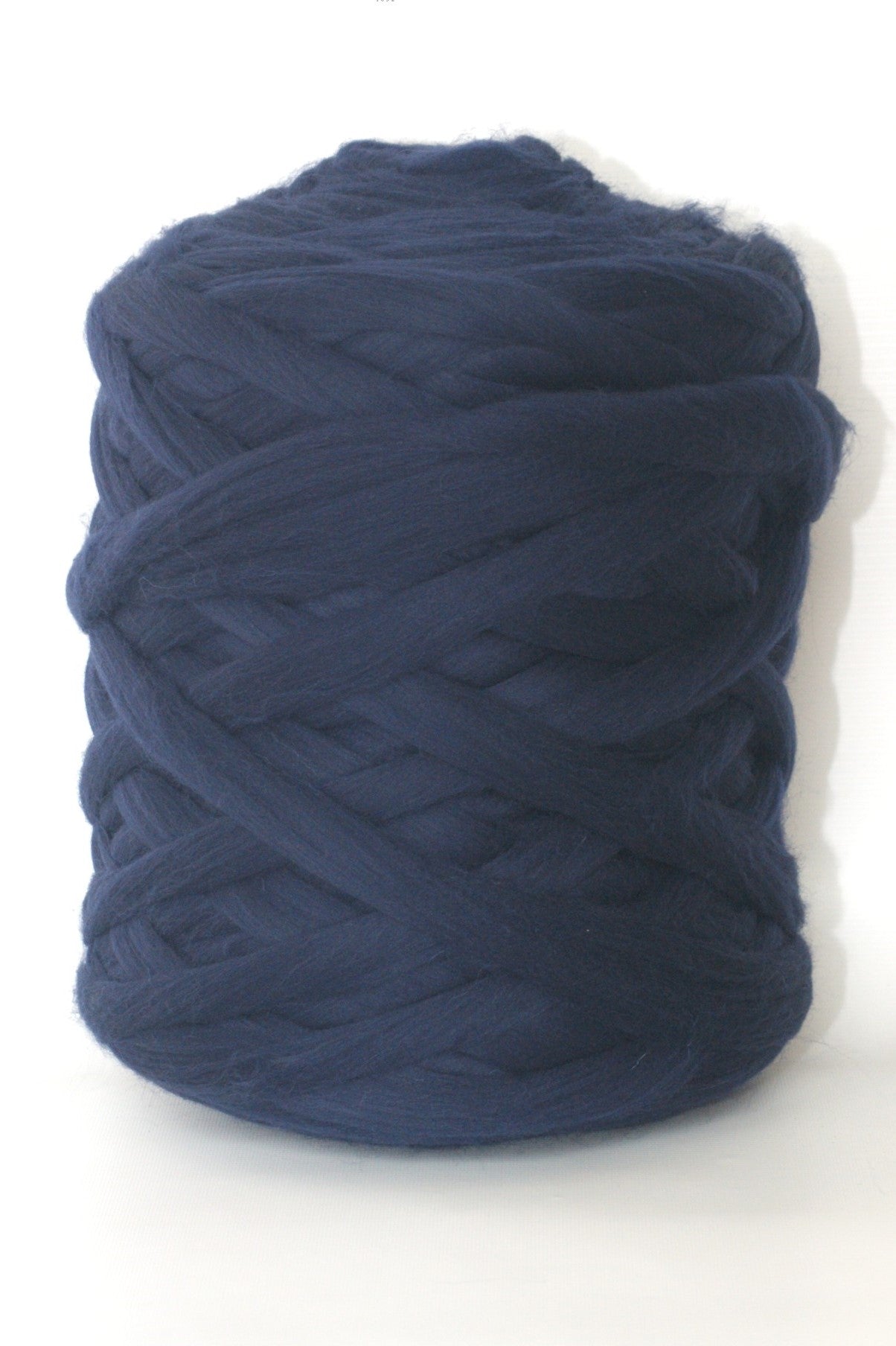Navy blue skein of chunky wool yarn on a white background