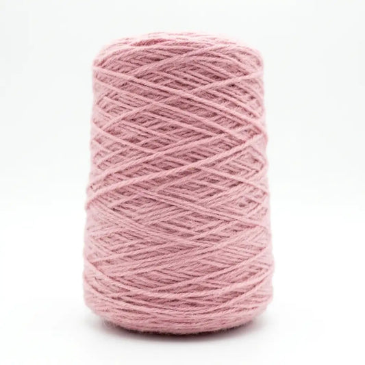 Pink skein of new zealand wool yarn on a white background