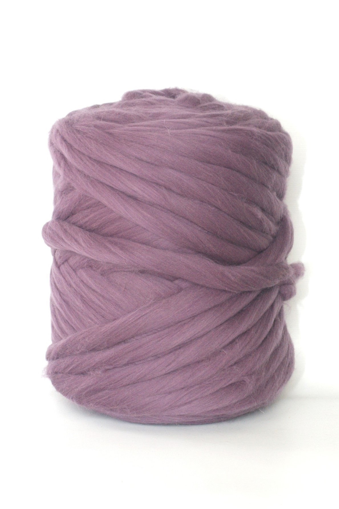 Ball of Pale purple wool yarn on a white background