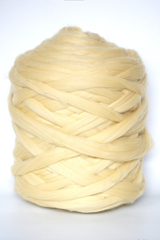 pastel yellow chunky wool yarn ball on a white background