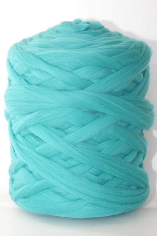 Turquoise wool yarn ball on a white background